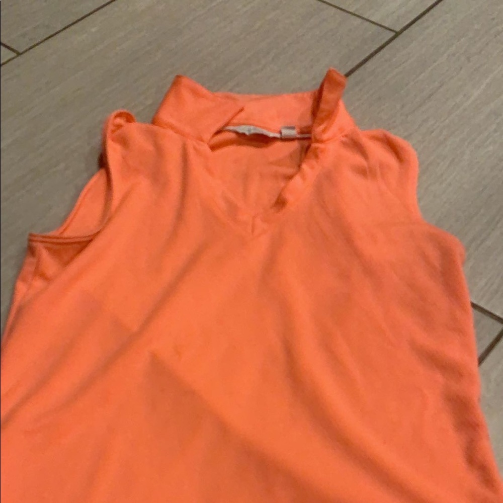 orange golfing or tennis shirt